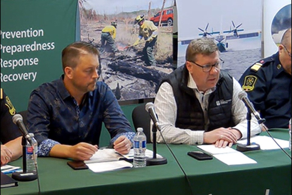 Minister of Corrections, Policing and Public Safety Tim McLeod and Premier Scott Moe at Friday's wildfire briefing in Prince Albert.