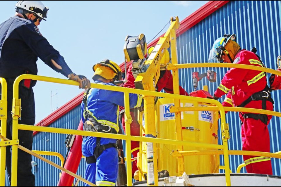 Fire and rescue personnel from Weyburn and area fire departments took part in the Grain-safe training on Saturday at the Weyburn Fire Department, using a simulator of a grain bin.