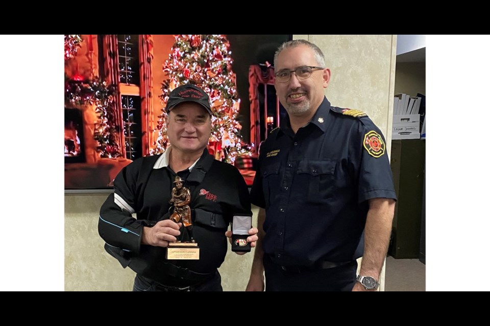 Humboldt fire chief  Mike Kwasnica, right, presented Darcy Leonew with a 40-year service award with the Humboldt Fire Department. Humboldt Fire presented eight service awards for their decades with the department.