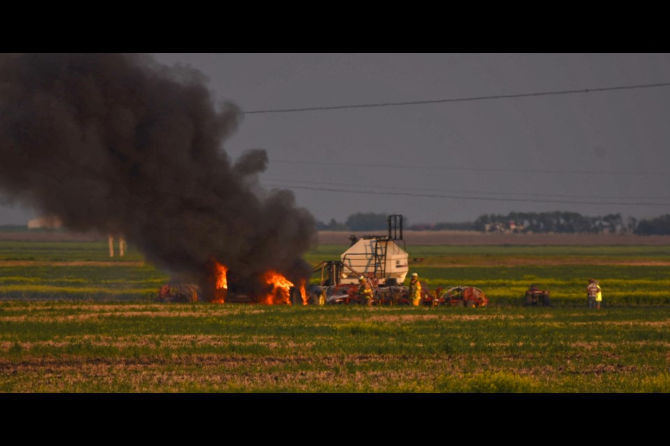 Smoke could be seen for several miles as crews from the Pense Fire Department work to control a tractor fire.