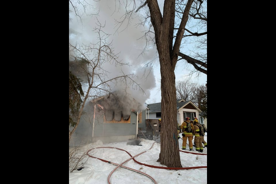 Crews battle through heavy smoke to extinguish a house fire in the 1100 block of Rae Street.