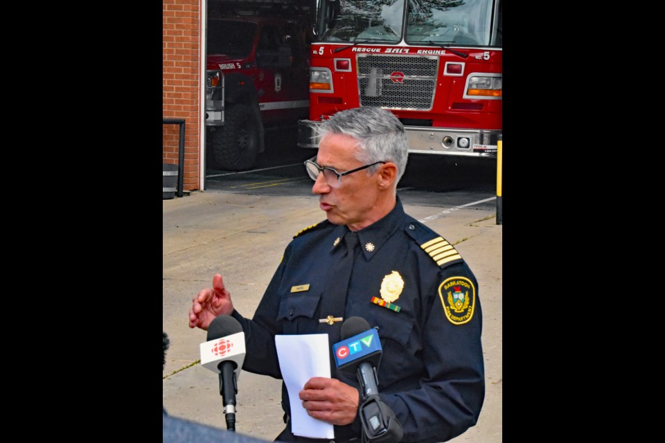 Saskatoon Fire Department Chief Morgan Hackl answers questions from a reporter during Sunday's press conference at Fire Hall No. 5 on Central Avenue. 