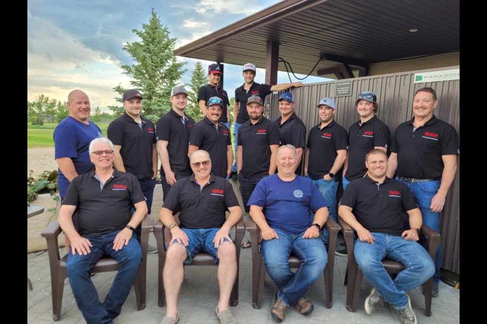 MFD team bonding at a summer barbecue: back top row - Neyl Manlapig, Cole Bast, middle row - Terry Elder, Cam Putz, Logan Sieben, Lance Legge, Cody Heffner, James Stang, Therin Doetzel, Aiden Knox, Peter Sieben; front row - Pat Stang, Rod Soderlund (retired), Chief Justin Bast and Deputy Chief Greg Bast. Missing from the photo are Gary Walz, Anderson Bast, Stephen Lowe, Andre Benwell and Ty Kohlman.