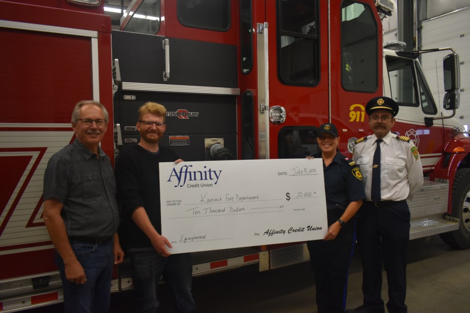 Left to right: On behalf of Affinity Credit Union, Joe Kozakewich presented a $10,000 cheque to Recreation Director Ben Sipple, Community Safety & Bylaw Enforcement Officer Sherise Fountain, and Fire Chief Ken Thompson. 