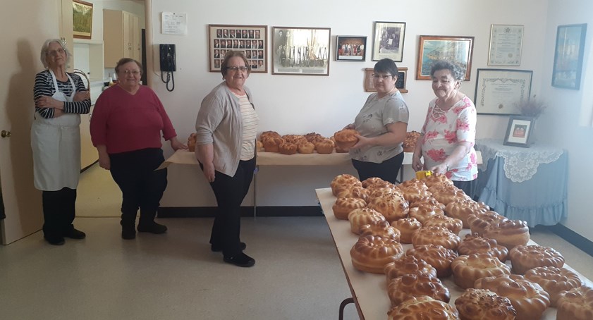 On March 23 and March 24 the Rainbow Hall ladies were busy making paskas and babkas for the first spring market on Saturday, March 25. Looking over the results of their work, from left, were: Olga Drozd and Rose Remenda of Canora, Helen Tymryk of Sturgis, Lorie Wasyliw of Canora, and Verna Melnychuk of Sturgis.