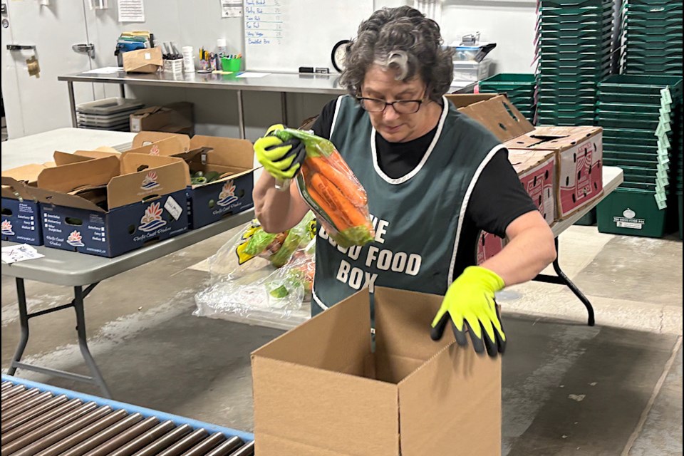 The scene at the location for REACH where they were busy packing items for their Indigenous-themed Holiday Basket.
