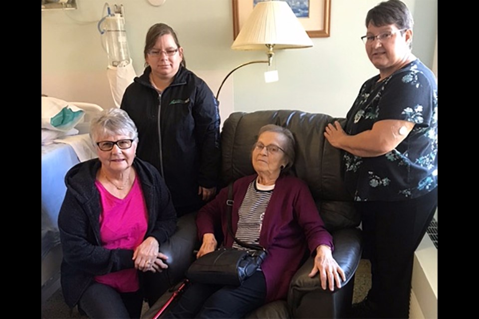 Iris Bodnarchuk enjoyed the comforts of the new recliner chair in palliative care, thanks to fundraising efforts by the Canora hospital auxiliary. Auxiliary members with her, from left, were: Angie Drobot, Jamie Wasyliw and Lorie Wasyliw (president).
