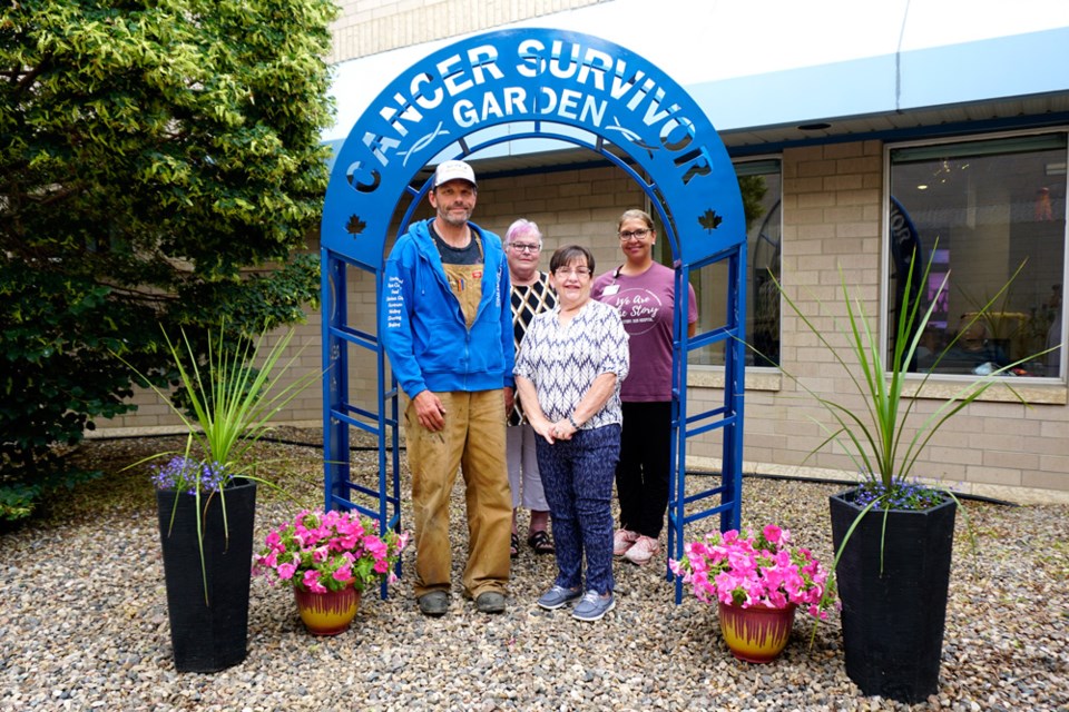 People involved with the Cancer Survivor Garden arch used for years during Estevan's Relay for Life gathered at the back entrance of St. Joseph's Hospital to celebrate its new forever home. From left, Randy Franke, KRJ owner who created the arch, Pat Steinke, former Estevan Relay for Life co-chairwoman, Candy Smyth, chairwoman of Cancer Survivor Garden committee, who brought the idea of the arch to Estevan, and Katie Bell, manager of the chemo ward at St. Joseph's Hospital.