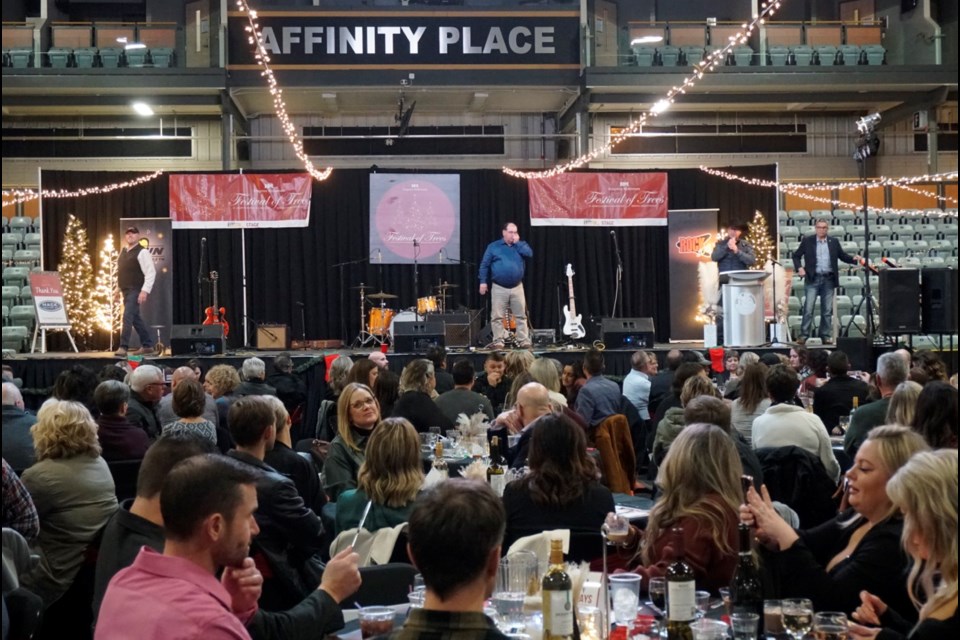 Norm Mack with Mack Auctions auctioned six travel packages, Michael Lonechild's painting and six Christmas trees, generating over $63,000 for the hospital.                               
