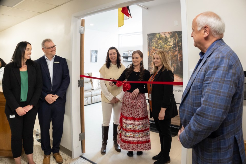 A ribbon cutting was held during the grand opening of the Palliative Hospice Suite. Krista Borgerson and Dr. Johann Roodt, Physician Executive for Integrated Rural Health (at left) watch as the ribbon is cut by Tracy Richard, Teah Harkness and Nadine Stevenson, with MLA David Marit at far right.