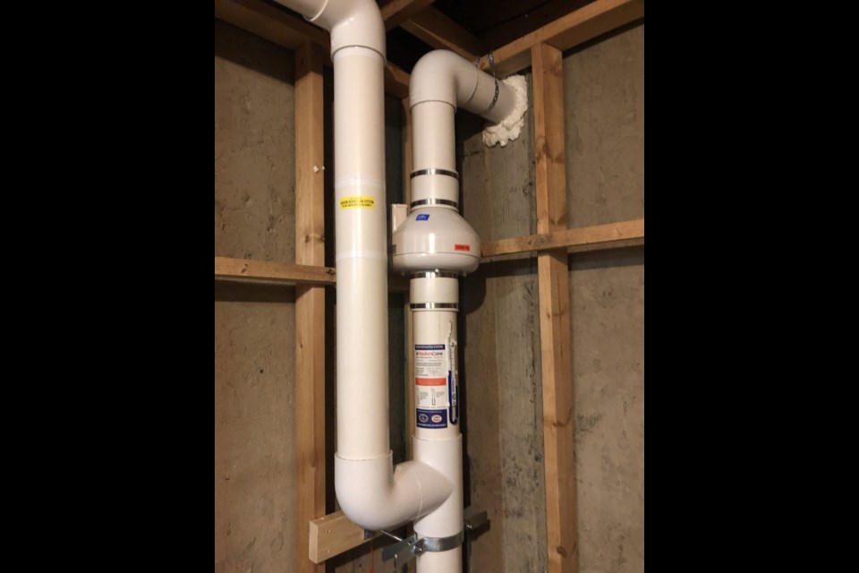 Radon Mitigation system with in-line fan exhausts toxic air from under the house to the outside.