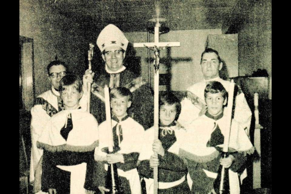 Bishop James Mahoney of the Roman Catholic Diocese of Saskatoon, flanked by Farther Schmidt of Leipzig and Father Jack Herman of Unity, with altar boys Gary Mitchell, David Hamm, and Michael and Timothy Leier. His Excellency was in the area for a week, administering the sacrament of confirmation at Unity, Macklin, Denzil, Reward and Scott.