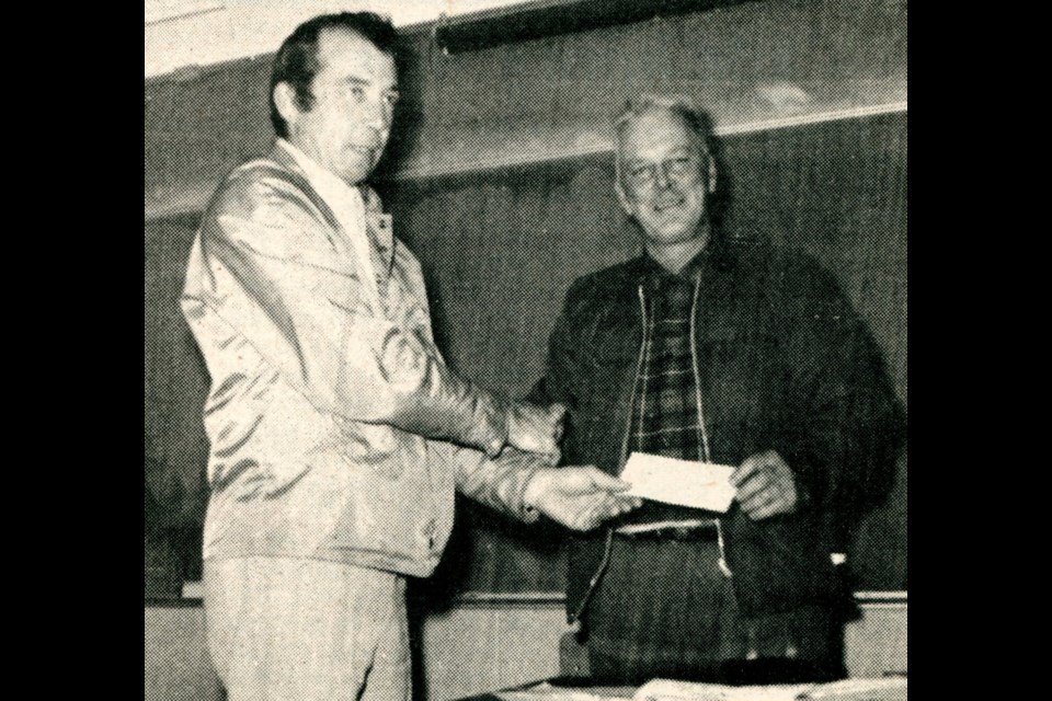 Rod Poelzer, left, president of the Landis Lions Club, presents a $1,025 cheque to James Braithwaite of the Landis Skating Rink Board, to go towards new dressing rooms and/or a new time clock. The funds came from a Lions Club sponsored walk-a-thon held earlier in 1972.