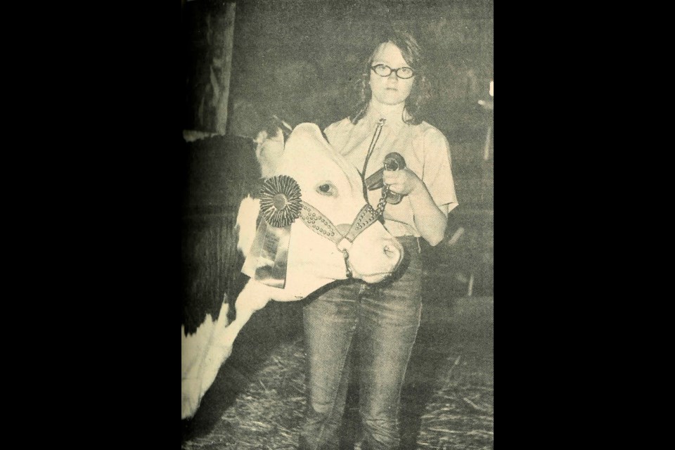 Janet Keay and her 1,050 pound Hereford, which was named Grand Champion at the Ruth 4-H Achievement Day and sold at 65 cents a pound.