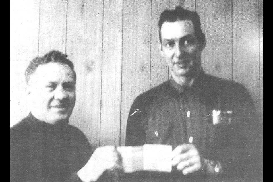 Don Wallace was the first winner of the 1972 series of $500 a month draws conducted by the Unity Hockey Association. Nick Brotzel presented the cheque on behalf of the hockey association.