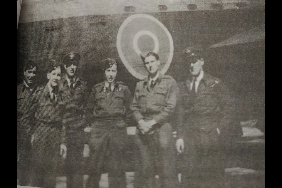 Schauenberg (third from left) and his crew in front of their Lancaster Bomber with No. 49 Squadron.