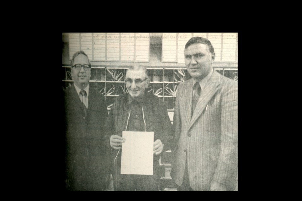 Mr. Wangler of Wilkie receives a 25-year pin and certificate for service to the Government of Canada from Wilfred Fink (right) Zone Postmaster of the North Battleford District. On Wangler’s left is local Postmaster Ray Friestad. Wangler began delivering mail in 1943, at first by horseback riding and later using vehicles. His route included Handel, Leipzig, Kelfield, Revenue, Tramping Lake and Broadacres.