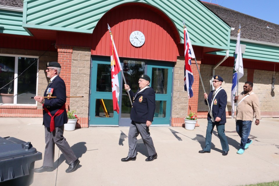 The Colour Guard marches in the flags during the ceremony.