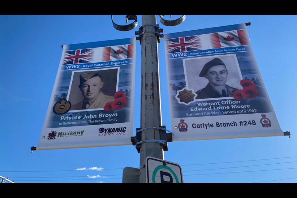 Two of the 32 banners that adorn the streets of Carlyle. 