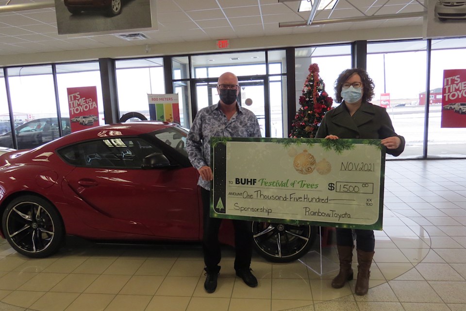 BUH Foundation’s Shauna McGifford with Dean Anderson, general manager with Rainbow Toyota.               