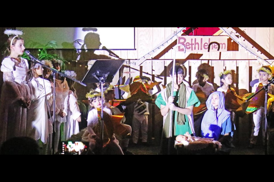 Angels and shepherds gathered to sing around the scene of the first Nativity, in the musical "Gloria", presented at Weyburn's Lighthouse Church on Friday evening.
