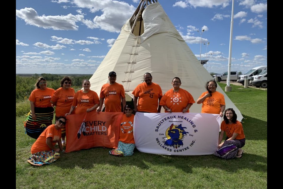 Sporting bright orange shirts, the accredited staff at the Saulteaux Healing and Wellness Treatment Centre (SHWC) in Badgerville included: back row, from left: Sarah Wapash, Yvonne Wapash, Ashley B. Straightnose, Floyd Keshane, Jason Keshane and Camilla Whitehawk; and  (front) Chantel Keshane, Doris Campeau and Jackie Skurat. Not available for the photo were: Sandy Cote, Phoebe Cote, Andy Keshane, Brandon Friday, Shirley McHugh, Philip Quewezance, Ronald Whitehawk, Elizabeth Wapash, and Dallas Papequash.