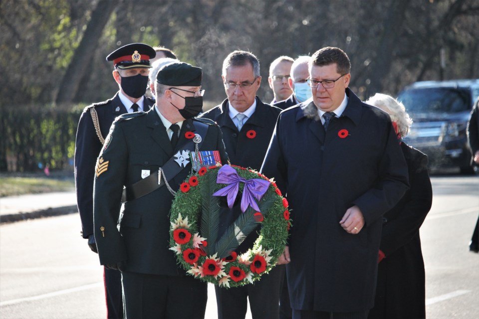 Premier Scott Moe and crowd attended to the Saskatchewan War Memorial following the service, which is located on legislature grounds.