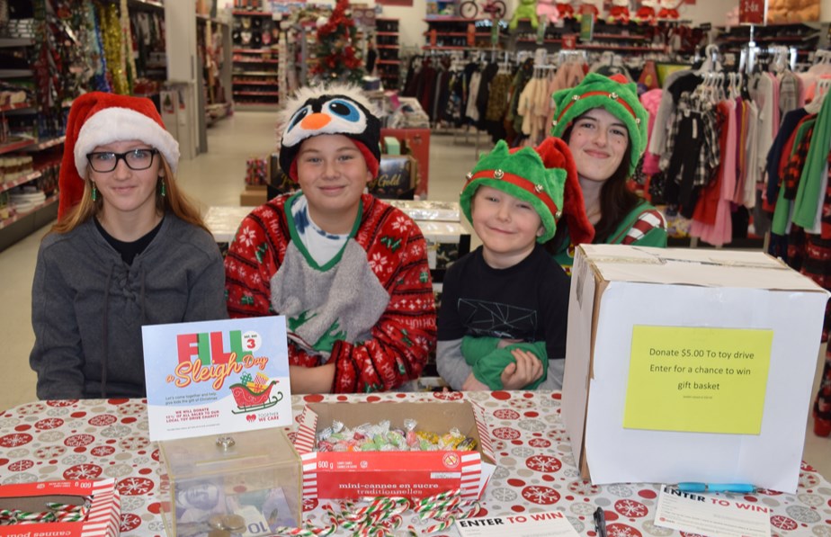 The success of Fill the Sleigh Day on Dec. 3 at the Red Apple Store was greatly aided by the work of young volunteers. Accepting donations, from left, were: Aubrey Monette, Chance Weinbender, Jax McLeod and Daylia Lukey.
