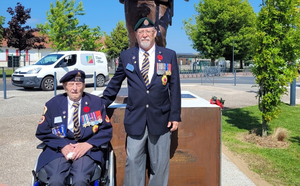 Jim Spenst, left, and his son Daryl at the 80th anniversary of D-Day in France. 