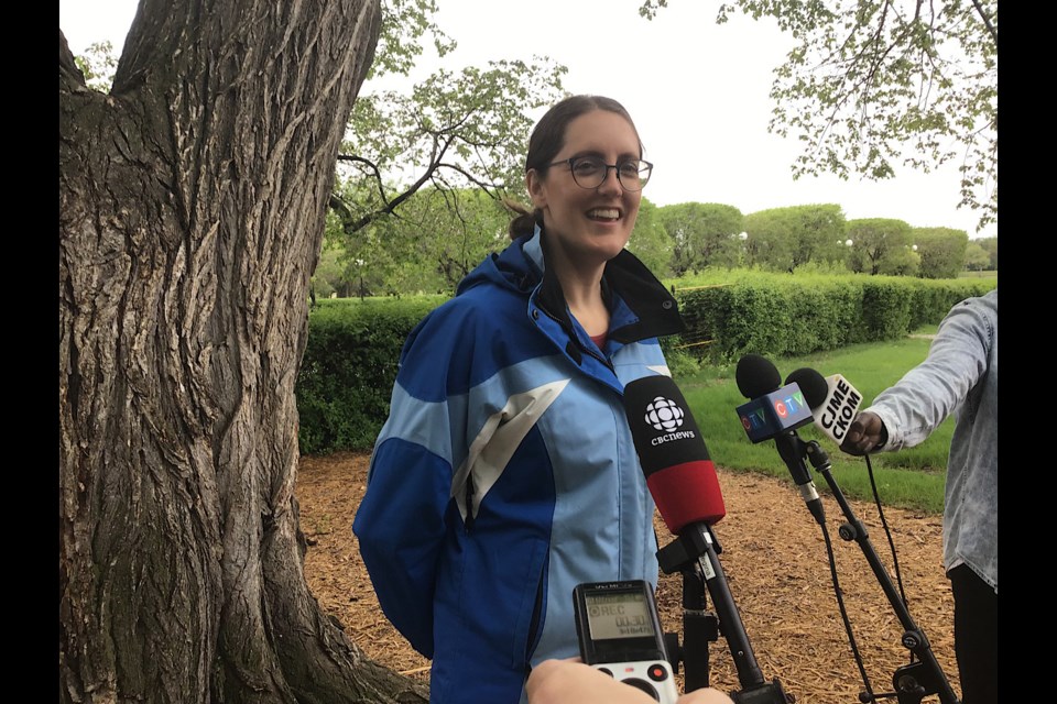 Jenna Schroeder, Executive Director of the Provincial Capital Commission, speaks to reporters on Arbor Day.