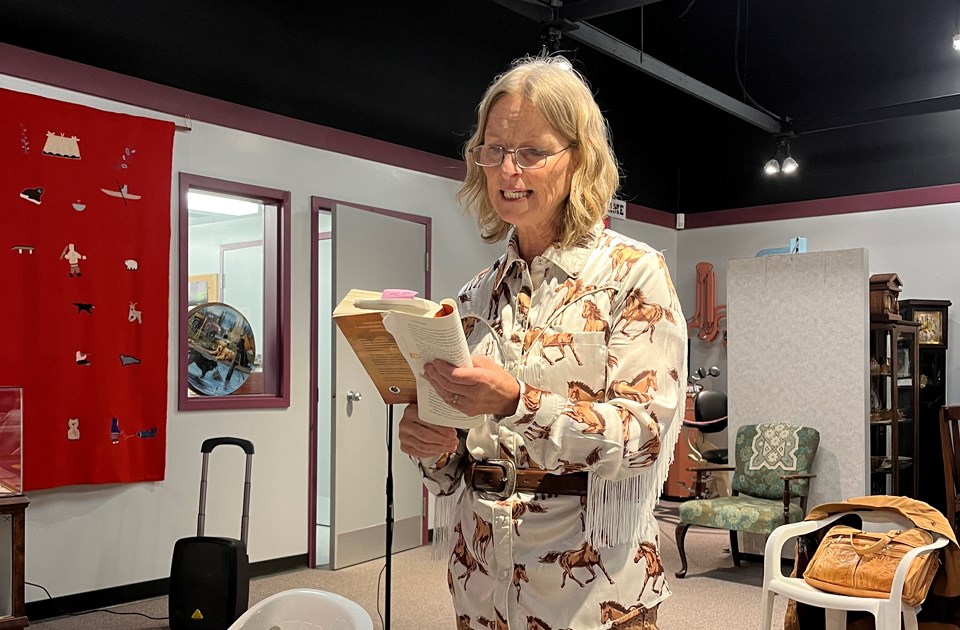 Author Gayle M. Smith reveals her characters as she reads from her novel with vivid expression at the Assiniboia Museum.
