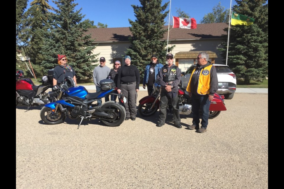 Lions motorcycle ride for dog guides stops in Borden Sept. 10. President Perry Nicol is on the right.