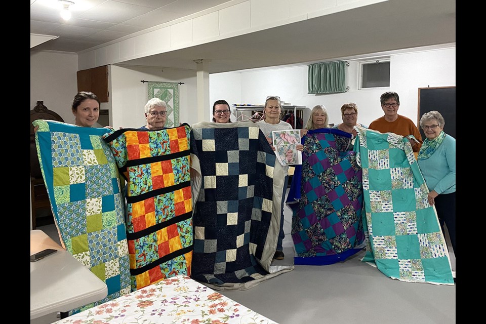 A group of women from Borden and Langham gathered at St. John’s Anglican Church lower hall throughout the winter months to work on quilts.