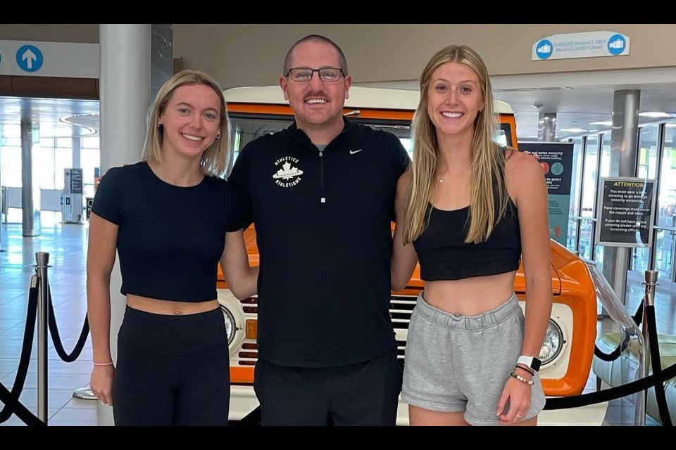 Avery Pearson, coach Jason Reindl and Savannah Sutherland at airport ready to take off to Columbia where the two athletes will compete in the U20 World Track and Field Championships in Cali.