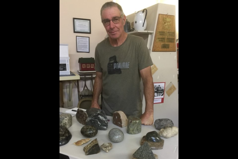 George Walker displayed and explained samples of his rock collection during Adventures at the Museum in Borden July 9. 