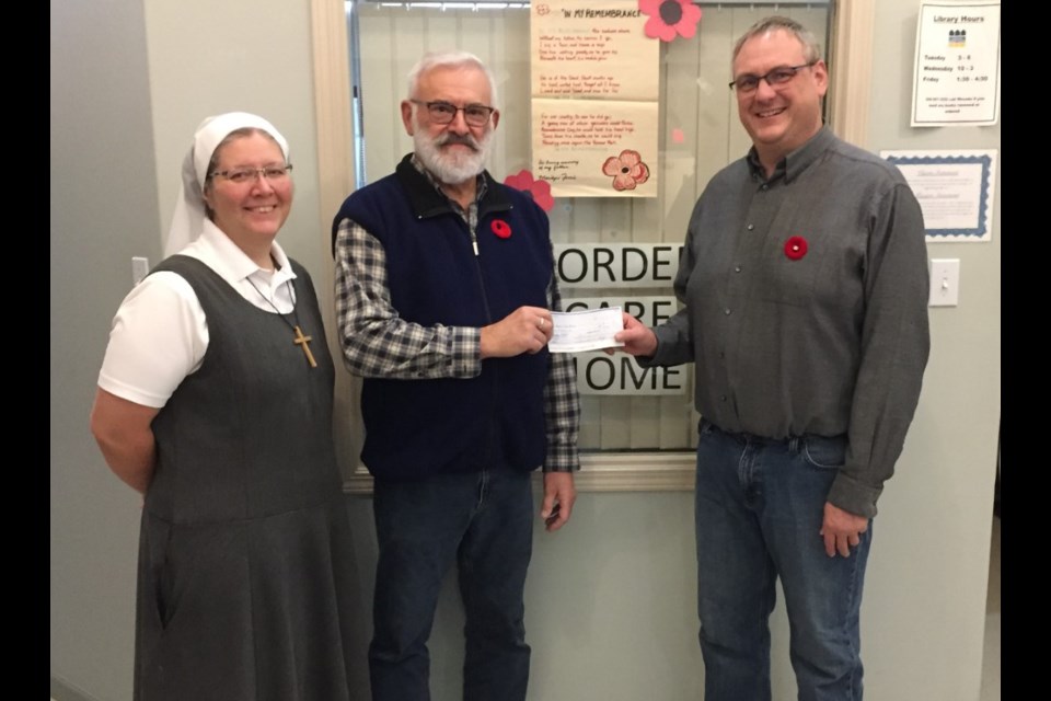 Borden Lions recently presented a donation to Borden Care Home. In the photo are Sister Peters, Ivan Youchezin and mayor and Lion, Jamie Brandrick. 
