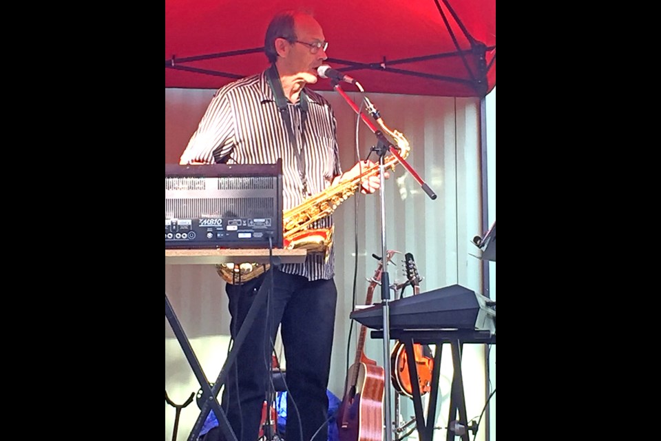 Neil Stubbs singing and playing saxophone at Radisson June 14. 