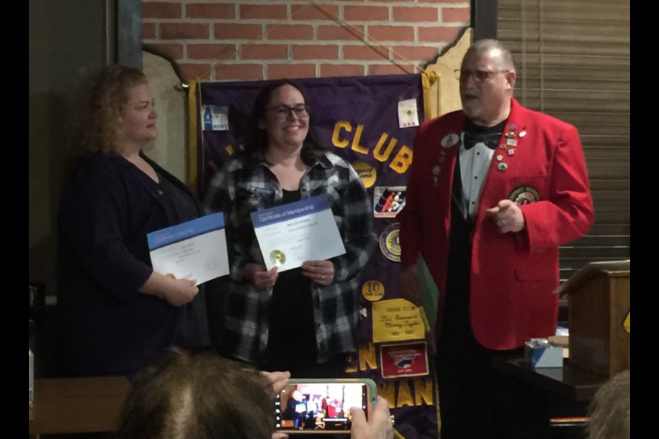 Kendall Redhead sponsoring new Borden Lions Club member Brittany Ketzel with District Governor Bernie Kramchynsky presenting pins and certificates. 