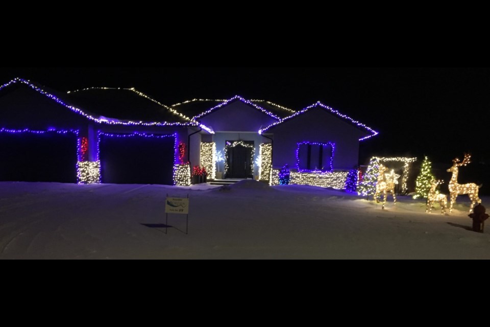 An outdoor Christmas display by Dustin and Brittany Tracksell earned first place in Borden