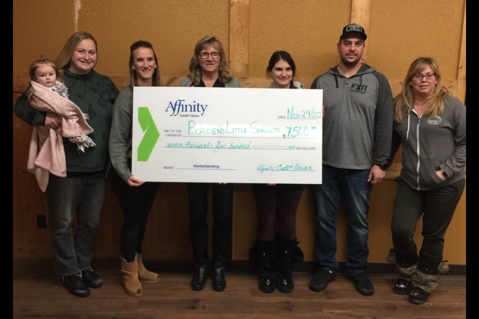Representatives of Little Sprouts Early Learning Centre accept a $7,500 donation from Peggy Walker representing Affinity Credit Union. 