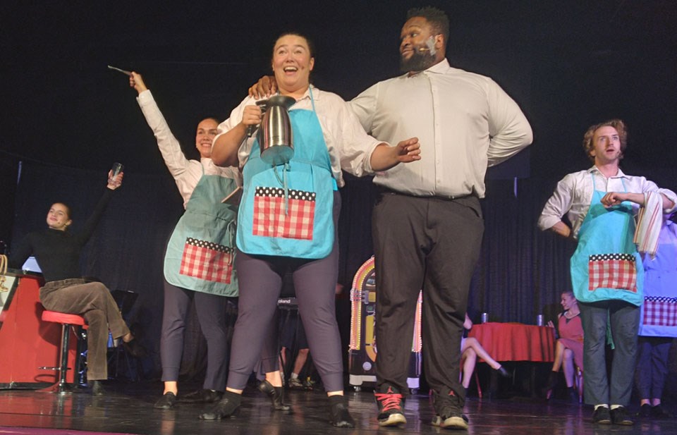Water jug in hand, Elizabeth Bishop, as a waitress, was centre stage with Matt Rapley during a SaskExpress number performed in Kamsack Aug. 15. 