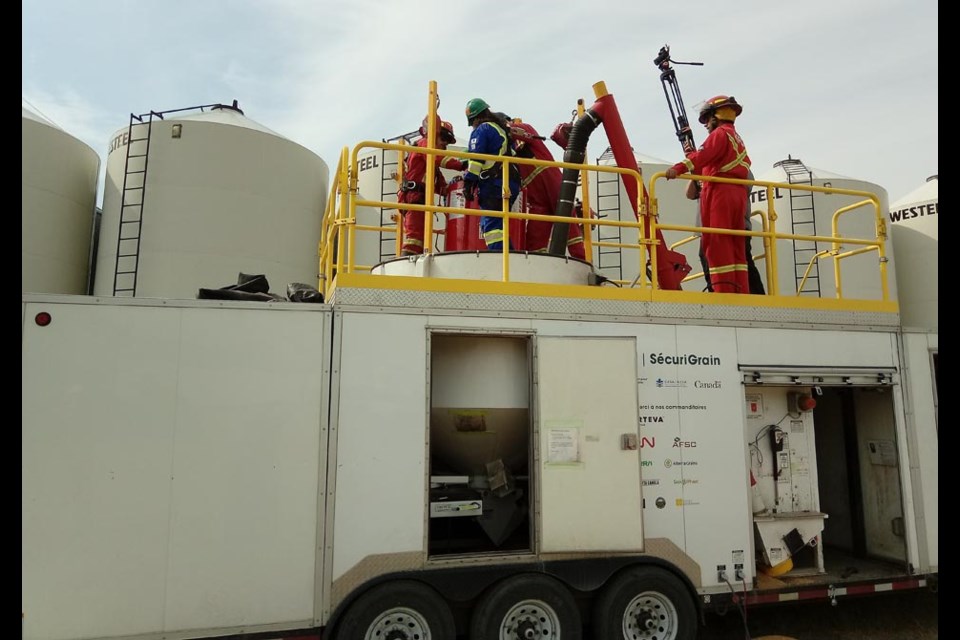 Kamsack firefighters used a bin in a grain trailer to conduct their grain rescue course held at Fedoruk Farms on July 12.