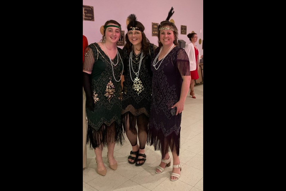 Three beauties sporting Roaring ‘20s apparel enjoying the great evening in Leoville May 5. 