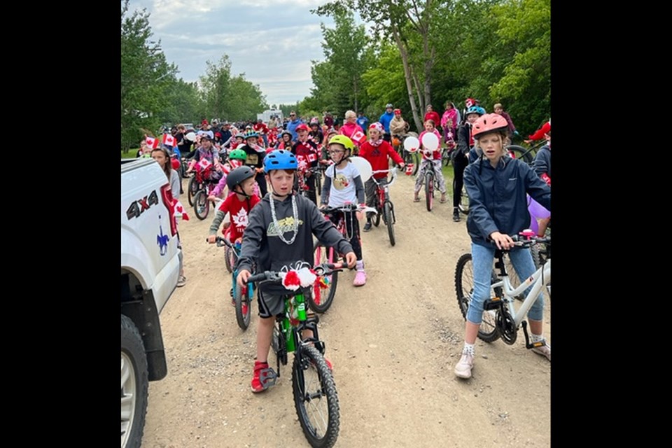 Eager to begin, Meota Regional Park bicycle parade participants idle at the starting line. 