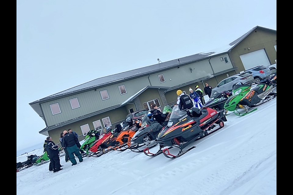 Vawn snowmobile rally participants stop to warm up at GMac Ag Team's Cavalier facility. 