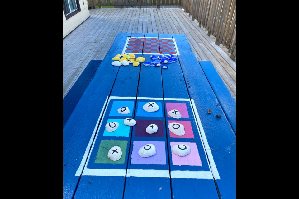 The picnic table outside Meota Lakefront Paddle and Sale clubhouse becomes a game board with new paint job during Meota’s Got Talent Aug 7