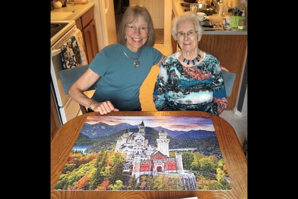 Trudy Janssens and her 98-year-old mother Mina Van Ee, who does one or more puzzles every week. This one is a 1,000-piece they have just finished. 
