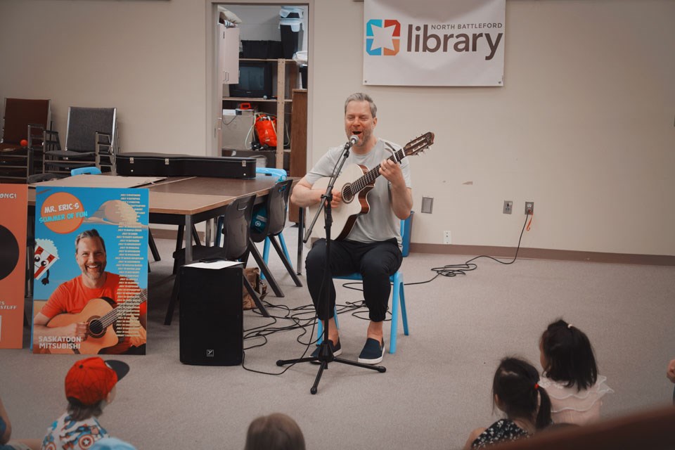 Mr. Eric singing and playing both familiar tunes and original songs