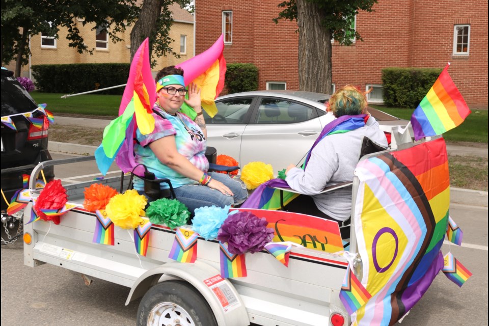 Margo Allaire and organizer of Pride Week activities in Yorkton rides a float.