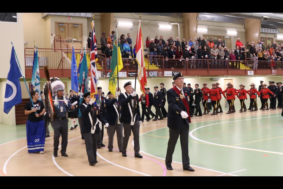 The parade is led by the flag bearers.